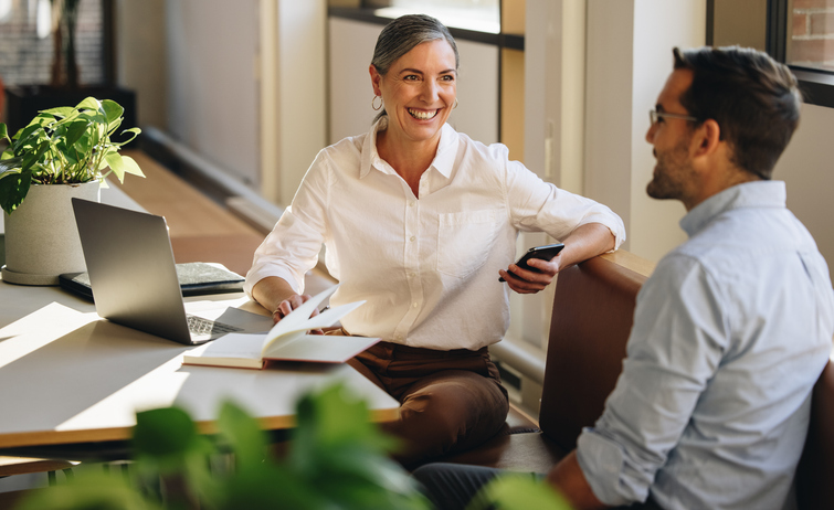 two people talking in a business setting